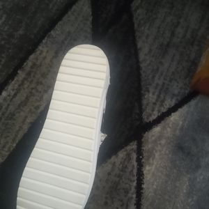 Cowprint slip on sneakers